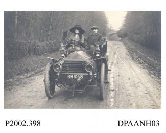 Postcard, black and white, showing couple driving car along Tunworth Road, Basingstoke Hampshire
