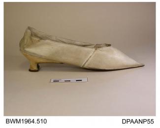Shoes, pair, women's, white kid, needlepoint toe, low curved Italian heel, lined white kid, white linen insole, leather sole, straights, sole waist is polished and underside of heel wedge is oulined in fine white stitching, approximate overall length 25