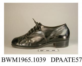 Shoe, one only, child's, black patent leather, front laced with five pairs of eyelets and narrow black laces over full length tongue, squared toe, curved side seam, straight rear seam, lined black kid, stacked leather heel, leather sole, approximate len