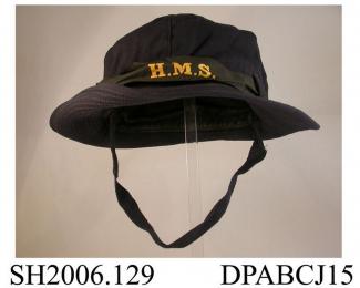 Hat, WRENS soft gabardine hat, black silk ribbon cap talley printed HMS, navy blue gabardine, soft crown in six sections, wide brim with stiffening and topstiched detail, lined with black cotton, navy wool braid chinstrap secured on right with two small