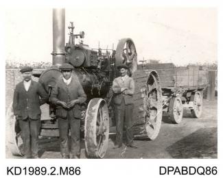 Photograph, black and white, showing  three men with a class C, built by Tasker and Co, Waterloo Foundry, Anna Valley, Abbotts Ann, Hampshire