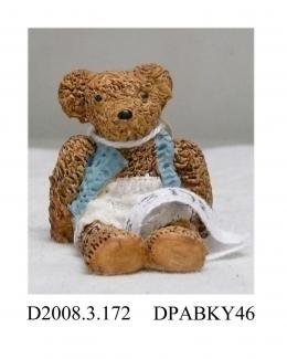 Teddy bear, 'Chocolate Chip' a ceramic Colour Box bear (ref No. 457) in sitting position, light brown textured finish, white shorts and blue waistcoat, gummed label on base with name and number, pottery mark impressed blue box with 'Colour Box Miniature