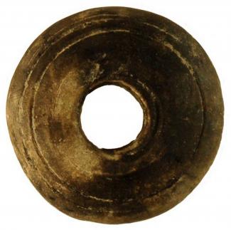 Stone spindlewhorl. From BSSC 1963-1964, Brook Street Site C, Winchester, Hampshire.