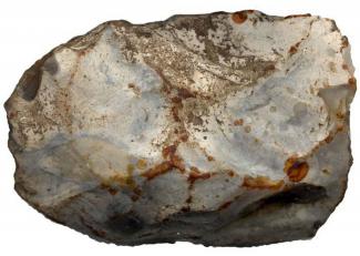 Small Neolithic flint axehead. From Silkstead, Otterbourne, Hampshire.