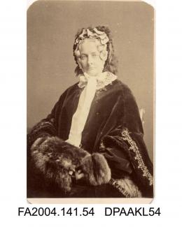 Photograph, Mrs Dobinson, seated wearing velvet cape and fur muff, taken by The London Stereoscopic and Photographic Companyvol 1, page 8