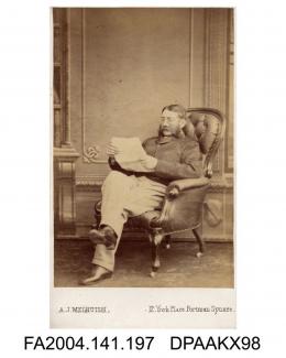 Photograph, Captain Edward McEvoy MP of the 6th Dragoon Guards, seated reading a letter, taken by A J Melhuish of Londonvol 1, page 26 - Military Witnesses for the Defendants