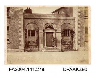 Photograph, an entrance to the officers' quarters at Clonmel Barracks with a soldier standing on the doorstep, probably taken by R Vervega, 1869vol 1, page 35