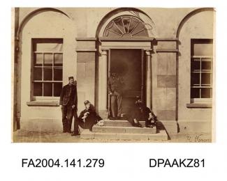 Photograph, an entrance to the officers' quarters at Clonmel Barracks with soldiers sitting and standing on the steps, taken by R Vervega, probably circa 1869vol 1, page 35
