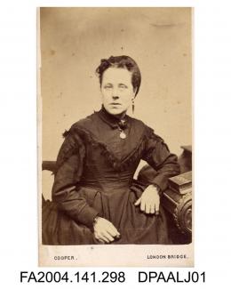 Photograph, Mrs Johnson, seated leaning her elbow on a desk, taken by M Felton Cooper of London Bridgevol 1, page 38 - Witnesses for the Defendants