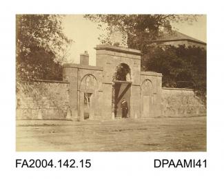 Photograph, the main entrance to the barracks at Clonmel with a soldier standing in the archway, possibly taken by R Vervega, 1869vol 2, page 19