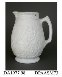Jug, hinged metal cover missing, white smear-glazed stoneware, pear shape, decorated with a relief-moulded design incorporating the national emblems of England, Scotland and Ireland; base, moulded registered design mark with encoded date of 26th June 18