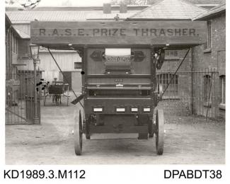 Photograph, black and white, showing a thrashing machine, RASE Prize thrasher, built by Tasker and Co, Waterloo Foundry, Anna Valley, Abbotts Ann, Hampshire