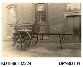 Photograph, sepia, showing a trailer, used by Northamptonshire County Council, built by Tasker, Waterloo Iron Works, Anna Valley, Abbotts Ann, Hampshire