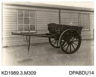 Photograph, black and white, showing a plank side farm cart, built by Tasker and Co, Waterloo Foundry, Anna Valley, Abbotts Ann, Hampshire