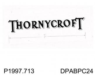 Negative, black and white, showing the Thornycroft logo