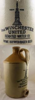 Stoneware flagon with cork stopper marked 'The Winchester United Aerated Co. Home Brewed Ginger Beer', from the Fox and Hounds Inn in Beauworth.