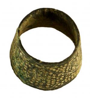 Copper-alloy sewing ring. From BS 1965-71, Brook Street site, Winchester, Hampshire.