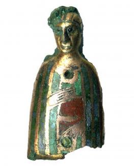 Reliquary figure made from gilt copper alloy with red, green and blue enamel. Also 649. From context 19, CHR76-80, Chester Road, Winchester, Hampshire. Excavated by K. Gordeuk and G. Scobie, 1976-80.