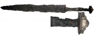 Anglo-Saxon iron seax with silver cocked-hat pommel and fittings, 7th century AD, from Oliver's Battery, Hampshire.